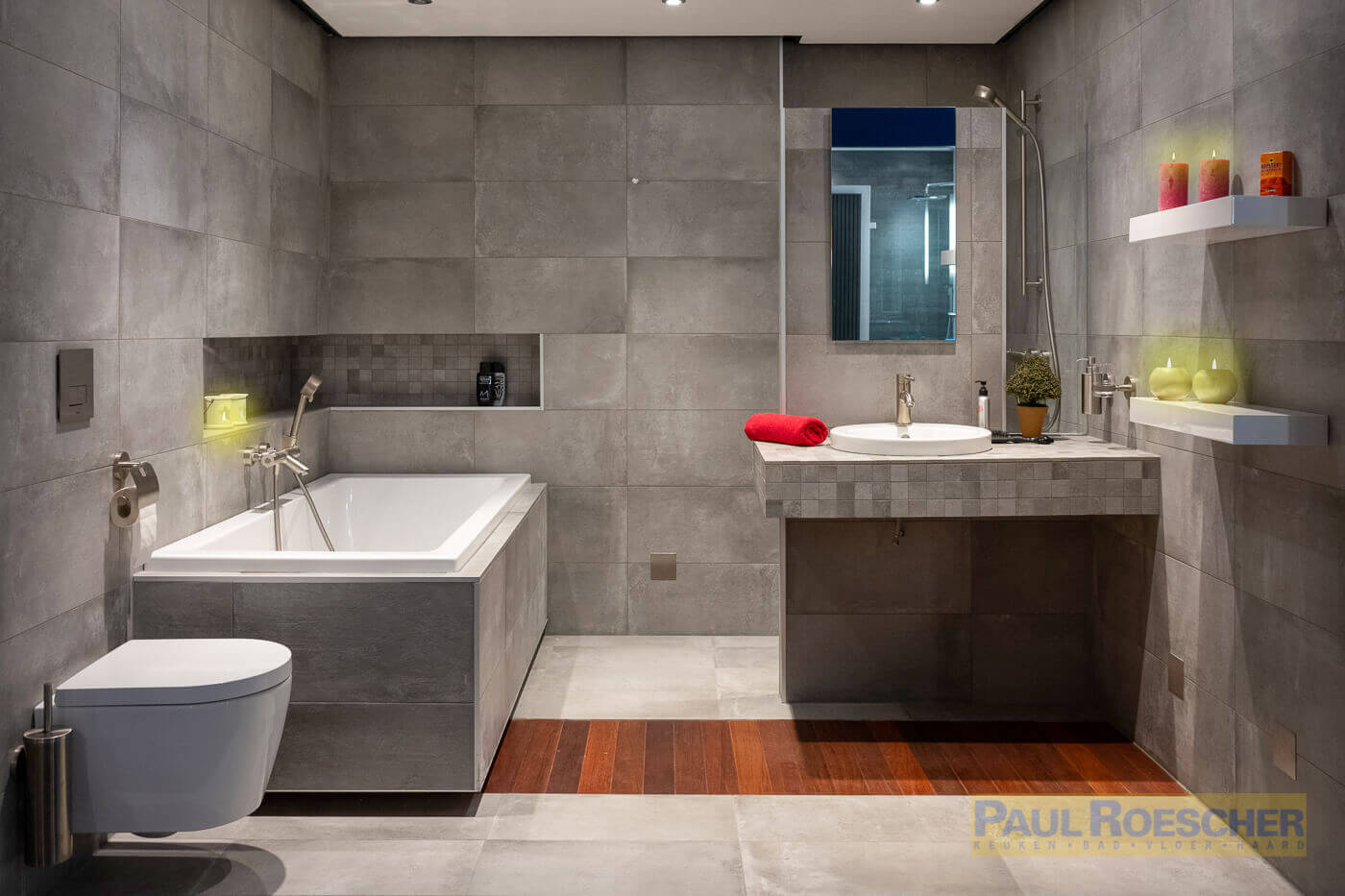 badkamer paul roescher met ligbad en grijze tegels